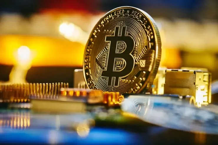 Bitcoin standing on motherboard